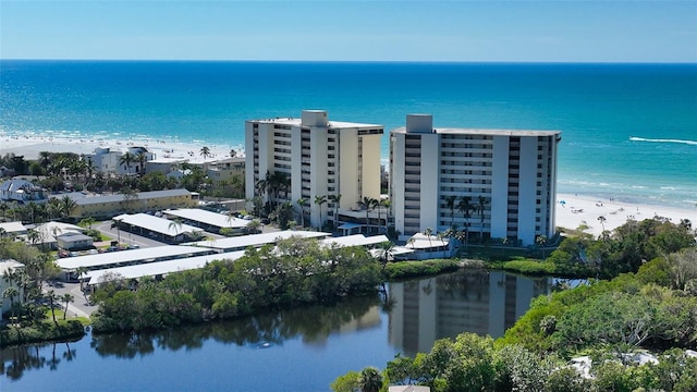 birds eye view of property with a view of the beach and a water view