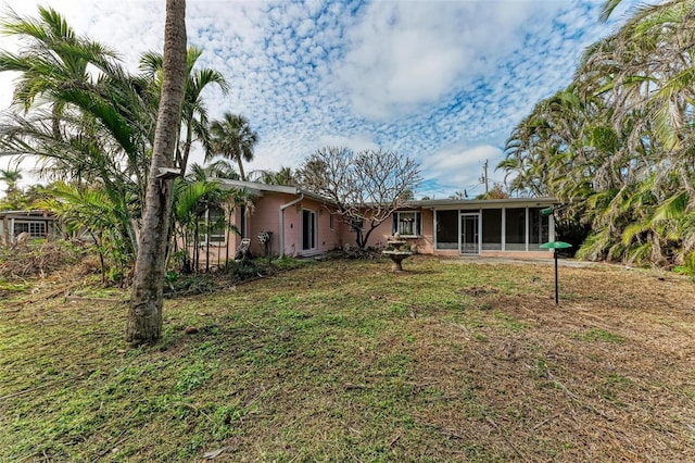 view of yard featuring a sunroom