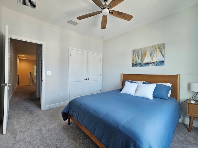 carpeted bedroom featuring ceiling fan and a closet