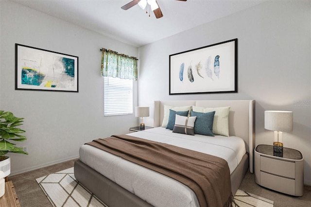 bedroom with ceiling fan and light colored carpet