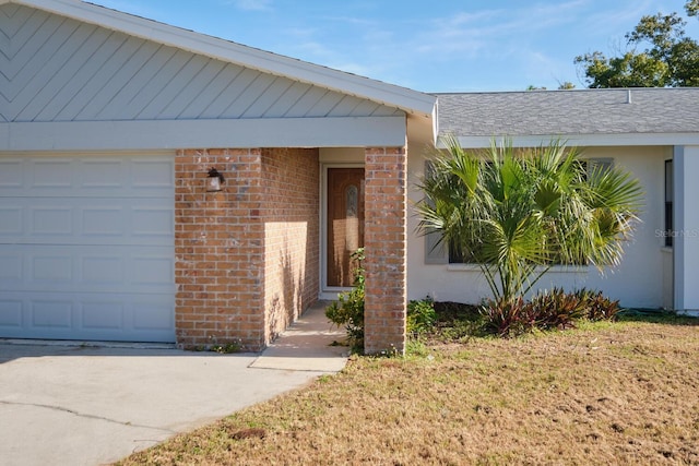 view of exterior entry with a garage