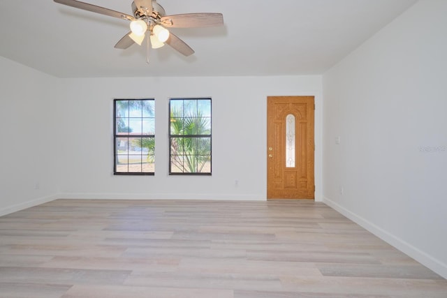 unfurnished room with ceiling fan and light hardwood / wood-style flooring