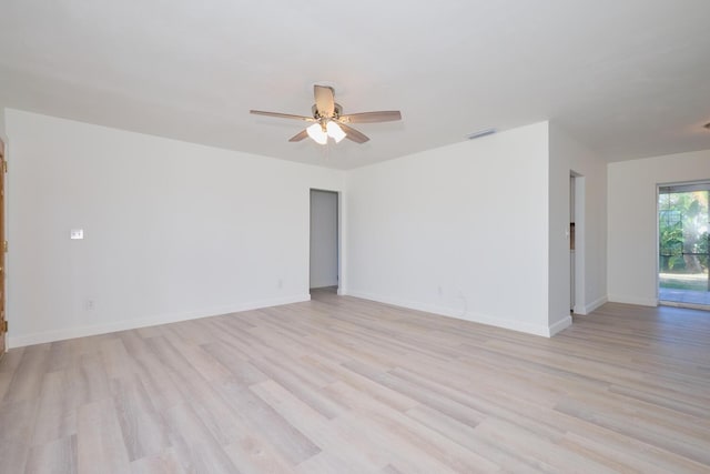 empty room featuring ceiling fan and light wood-type flooring