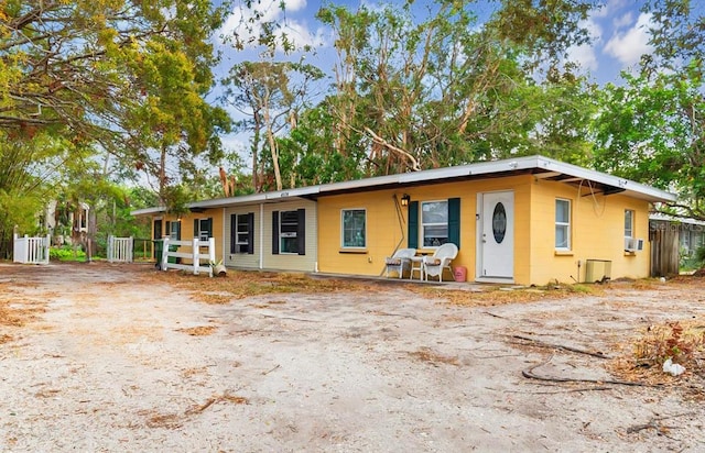 ranch-style house featuring cooling unit