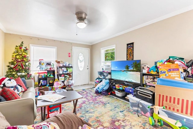 playroom featuring ornamental molding and ceiling fan