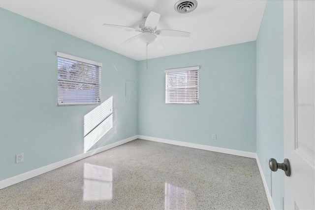 spare room with ceiling fan