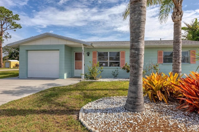 ranch-style home featuring a garage and a front lawn