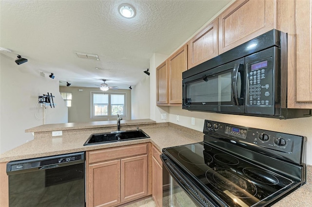 kitchen with black appliances, ceiling fan, kitchen peninsula, and sink