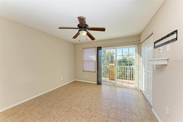 empty room featuring ceiling fan and light tile patterned floors