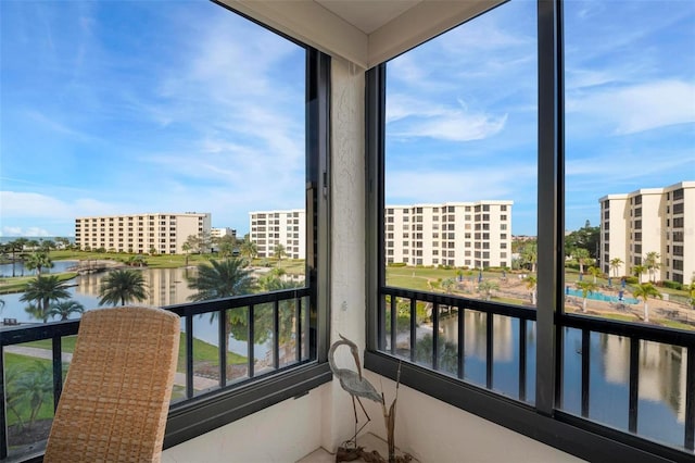 balcony featuring a water view