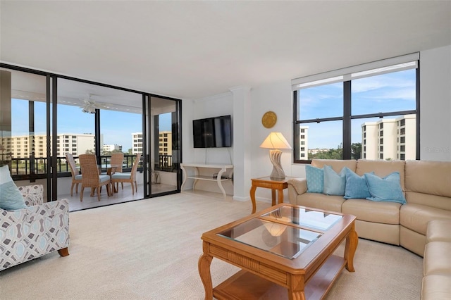 carpeted living room with floor to ceiling windows