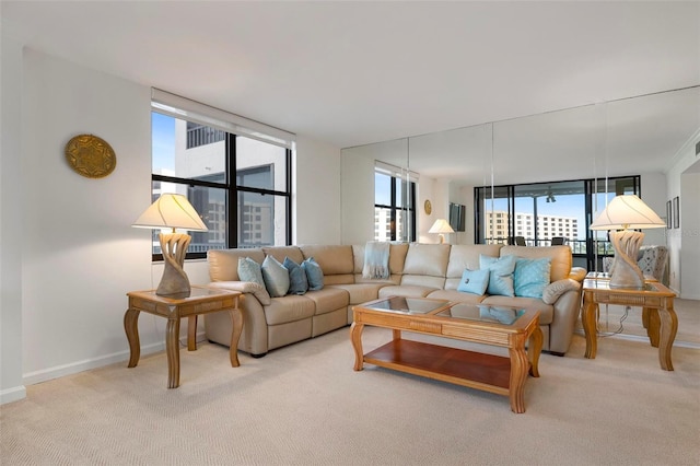 carpeted living room featuring floor to ceiling windows and a wealth of natural light