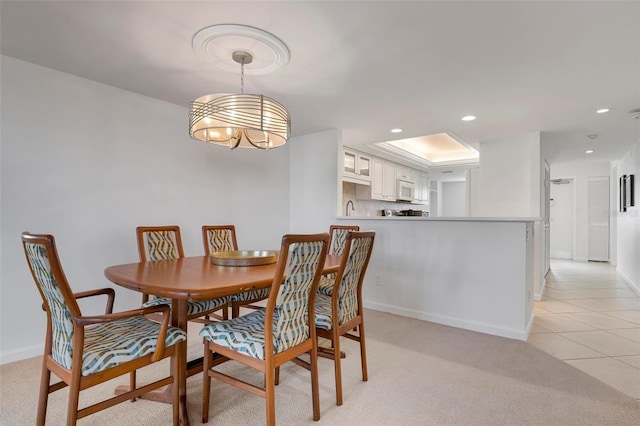 dining space featuring light tile patterned flooring