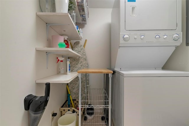 washroom with stacked washer / drying machine