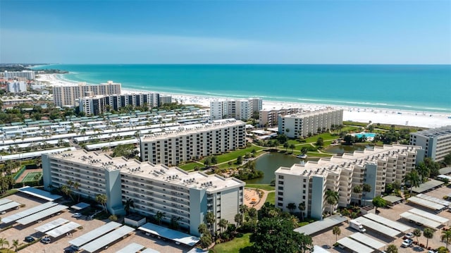 aerial view featuring a water view and a beach view