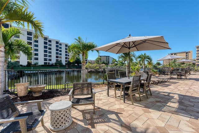 view of patio with a water view