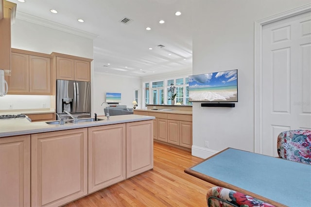 kitchen featuring light hardwood / wood-style floors, stainless steel refrigerator with ice dispenser, light brown cabinetry, crown molding, and sink