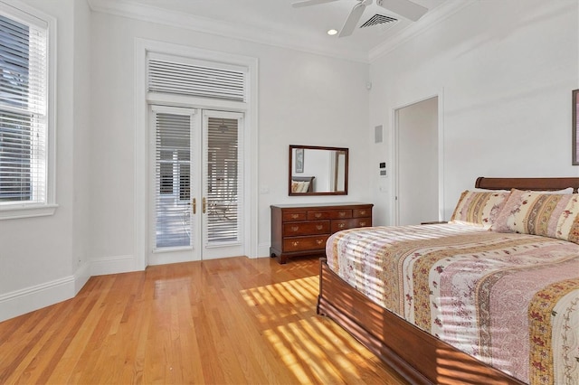 bedroom featuring light wood-type flooring, ceiling fan, access to exterior, and multiple windows