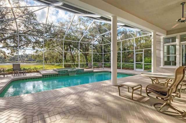 view of swimming pool with a lanai and a patio