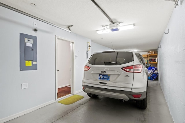 garage with electric panel and a garage door opener