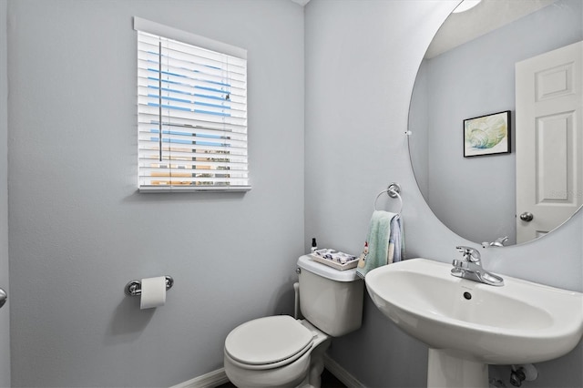 bathroom with toilet and sink