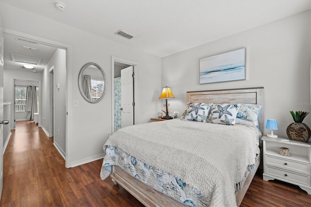 bedroom featuring dark hardwood / wood-style floors