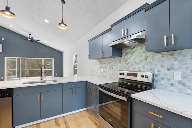 kitchen with lofted ceiling, hanging light fixtures, ceiling fan, blue cabinetry, and stainless steel appliances