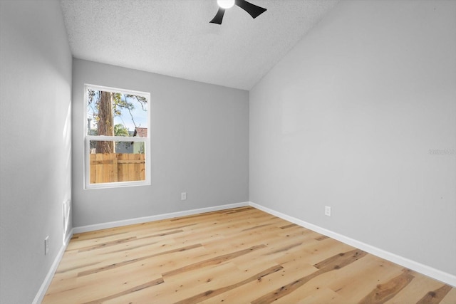 spare room with hardwood / wood-style floors, a textured ceiling, and ceiling fan