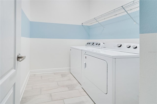 washroom with washer and dryer