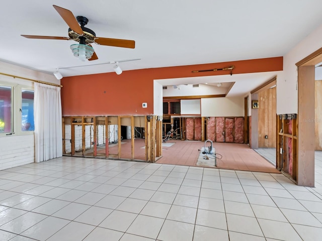 tiled spare room featuring ceiling fan and rail lighting