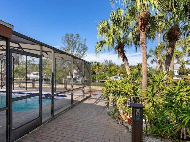 view of patio / terrace with a lanai