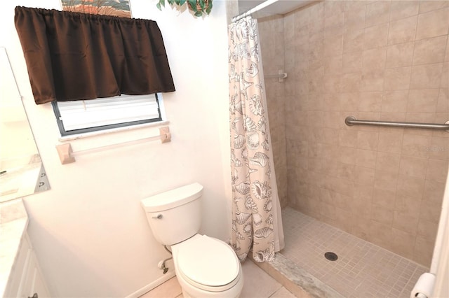 bathroom with tile patterned flooring, vanity, toilet, and walk in shower