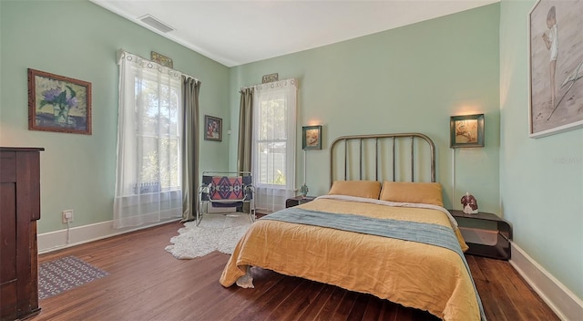 bedroom with hardwood / wood-style floors