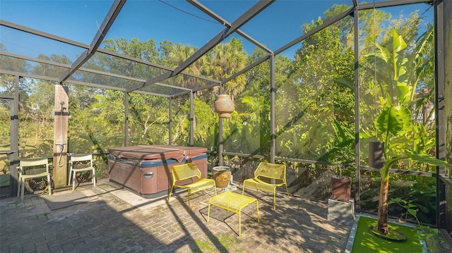 view of patio with a lanai and a hot tub