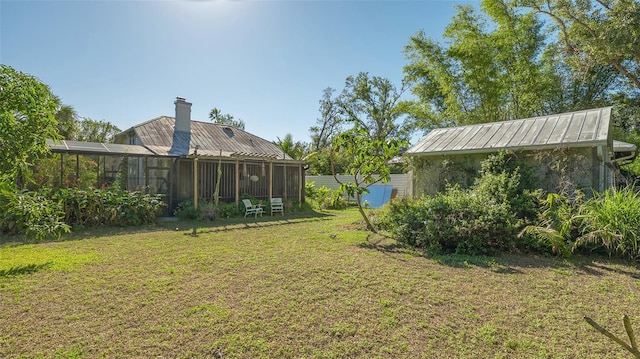 view of yard with a sunroom