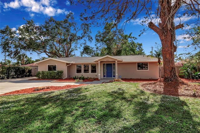 ranch-style home with a front yard