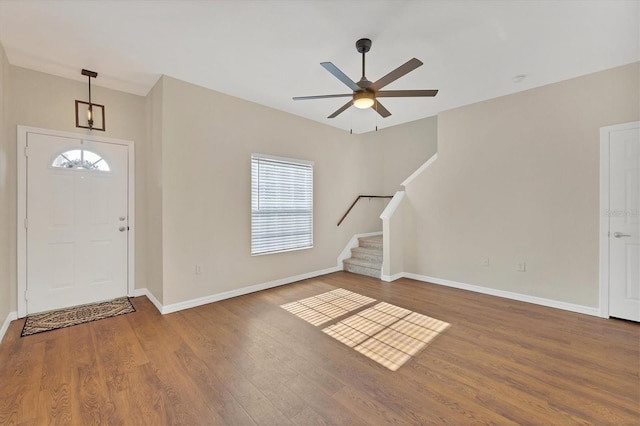 foyer entrance with hardwood / wood-style flooring and ceiling fan