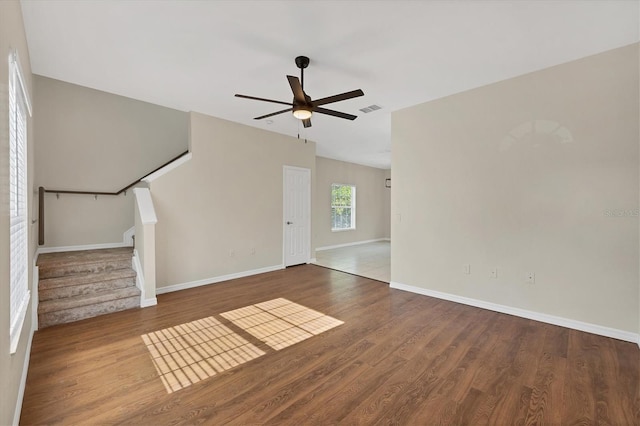 7664 Plantation Cir, Bradenton, FL 34201 - unfurnished living room featuring hardwood / wood-style floors and ceiling fan