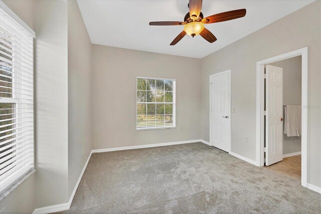 7664 Plantation Cir, Bradenton, FL 34201 - unfurnished bedroom with ceiling fan and light colored carpet