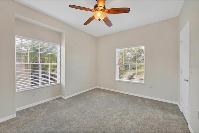 7664 Plantation Cir, Bradenton, FL 34201 - empty room featuring plenty of natural light, ceiling fan, and light colored carpet
