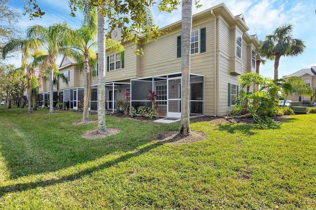 7664 Plantation Cir, Bradenton, FL 34201 - rear view of property featuring a sunroom and a yard
