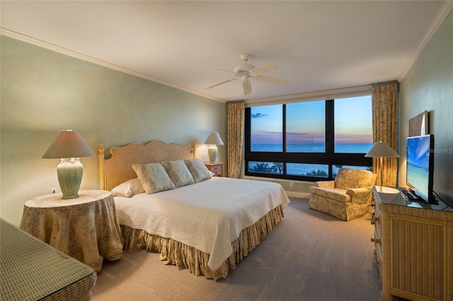 carpeted bedroom with ceiling fan and crown molding