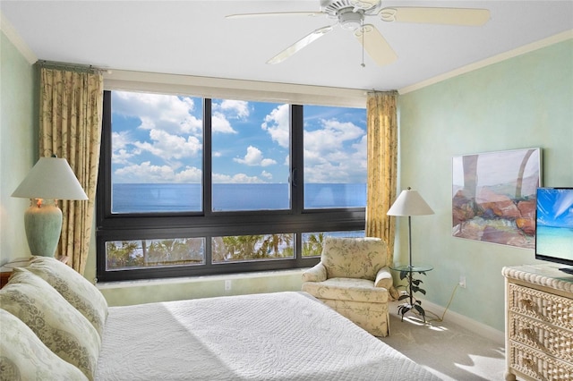 bedroom with carpet, ceiling fan, crown molding, and multiple windows