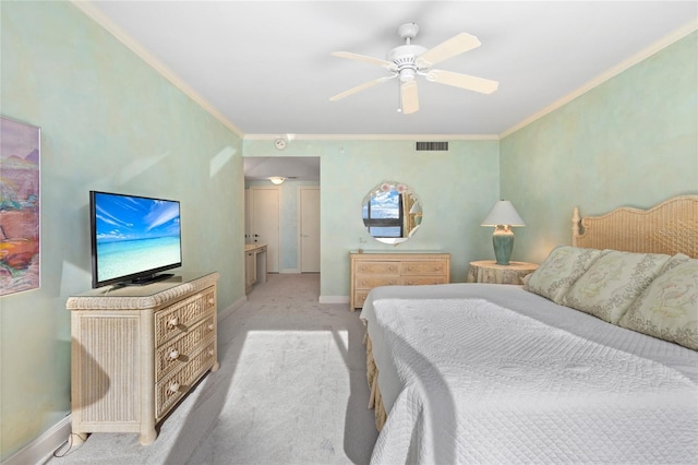 carpeted bedroom featuring ceiling fan and crown molding