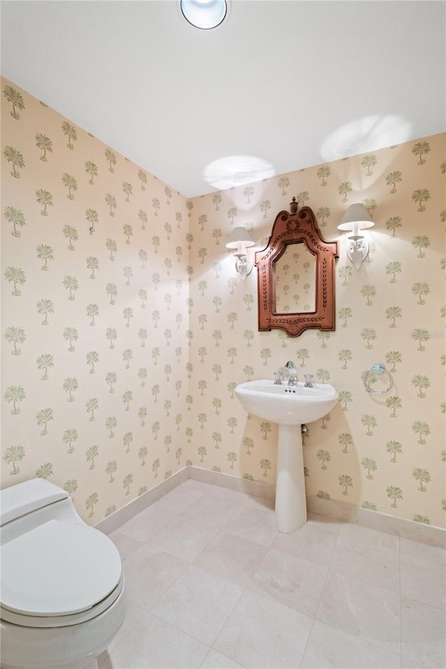 bathroom with tile patterned flooring and toilet