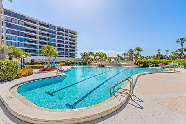 view of pool featuring a patio area