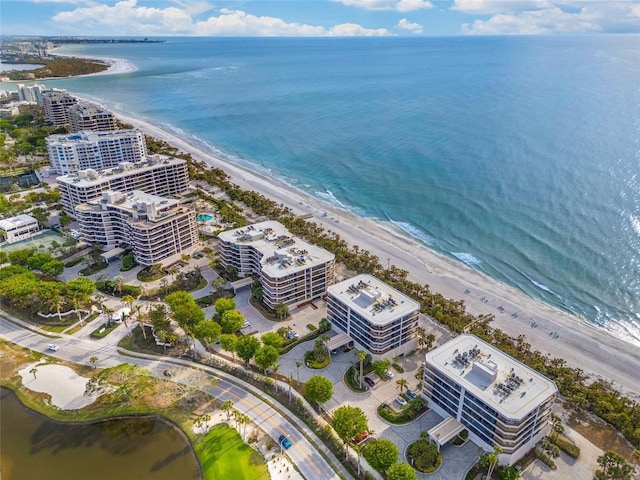 aerial view featuring a water view and a beach view