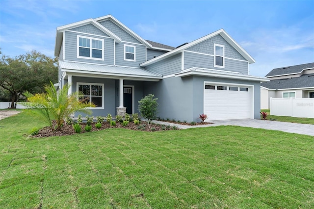 craftsman-style house featuring an attached garage, driveway, a front lawn, and fence