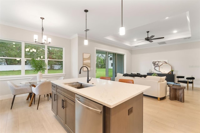 kitchen featuring dishwasher, ornamental molding, light wood finished floors, and a sink