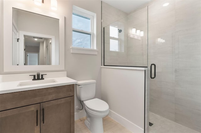 full bath featuring toilet, a shower stall, baseboards, and vanity